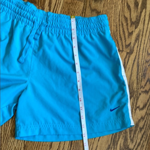Bright turquoise with white side stripe Nike shorts with pockets, size women’s L - Picture 15 of 16